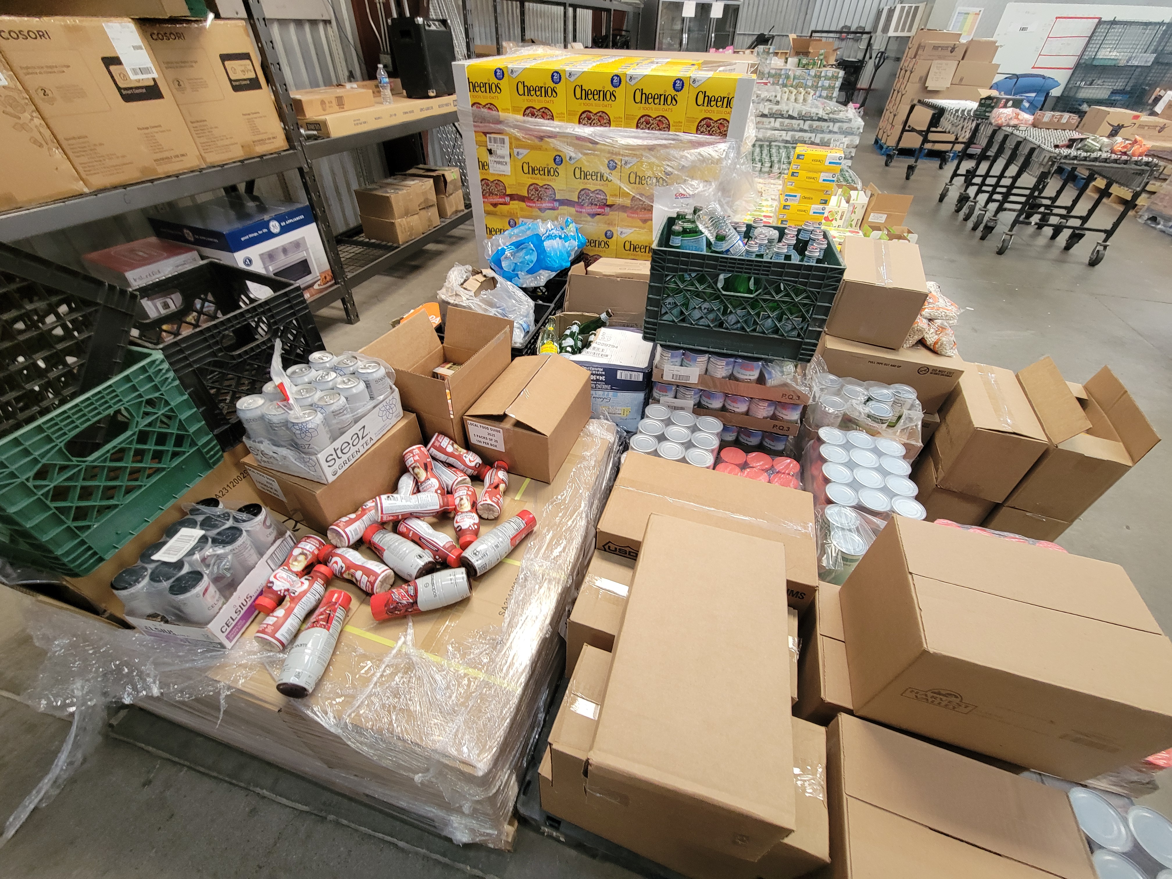 Pallets full of boxes and bags of different foods.
